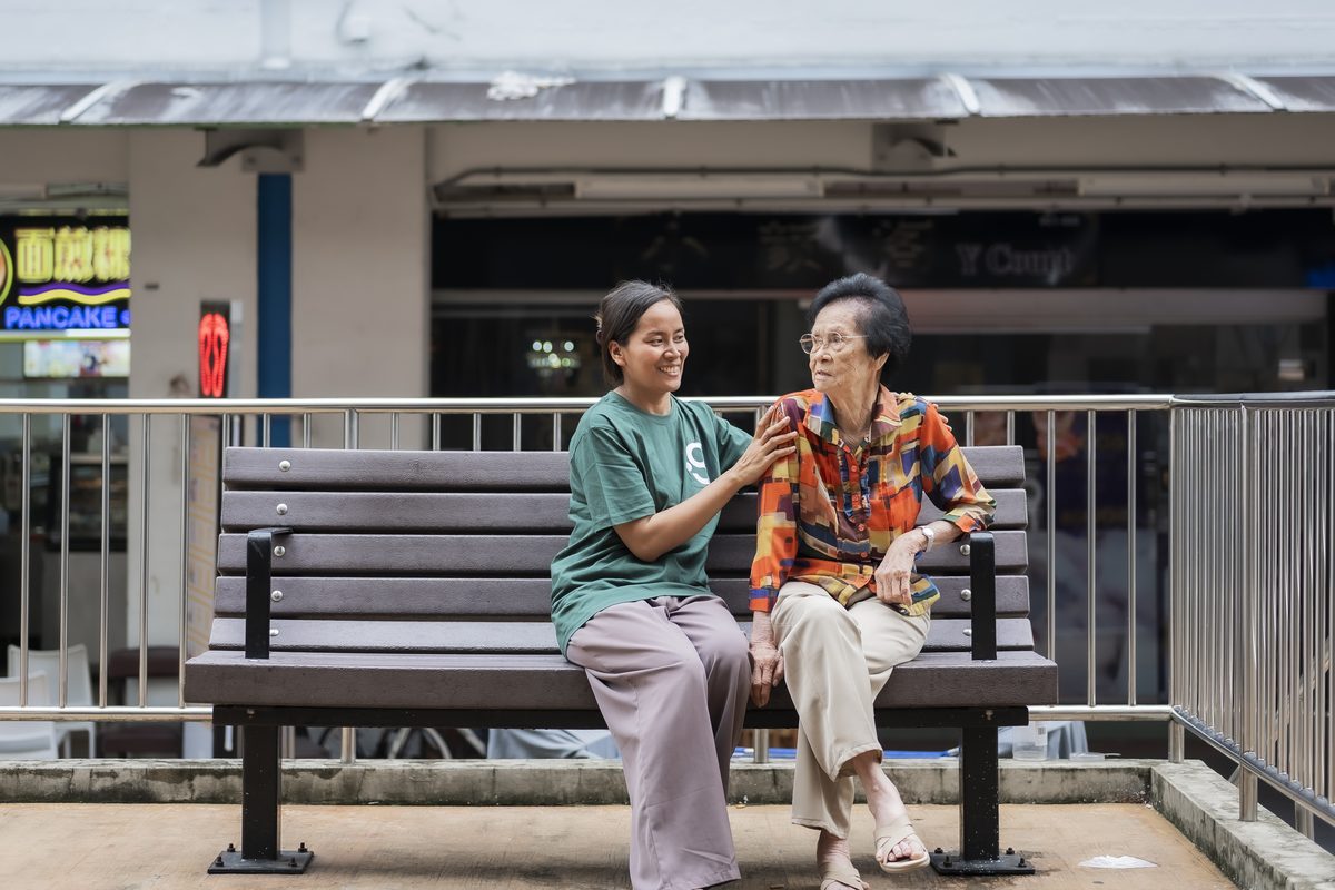 A Green Employment helper caring for an elderly client