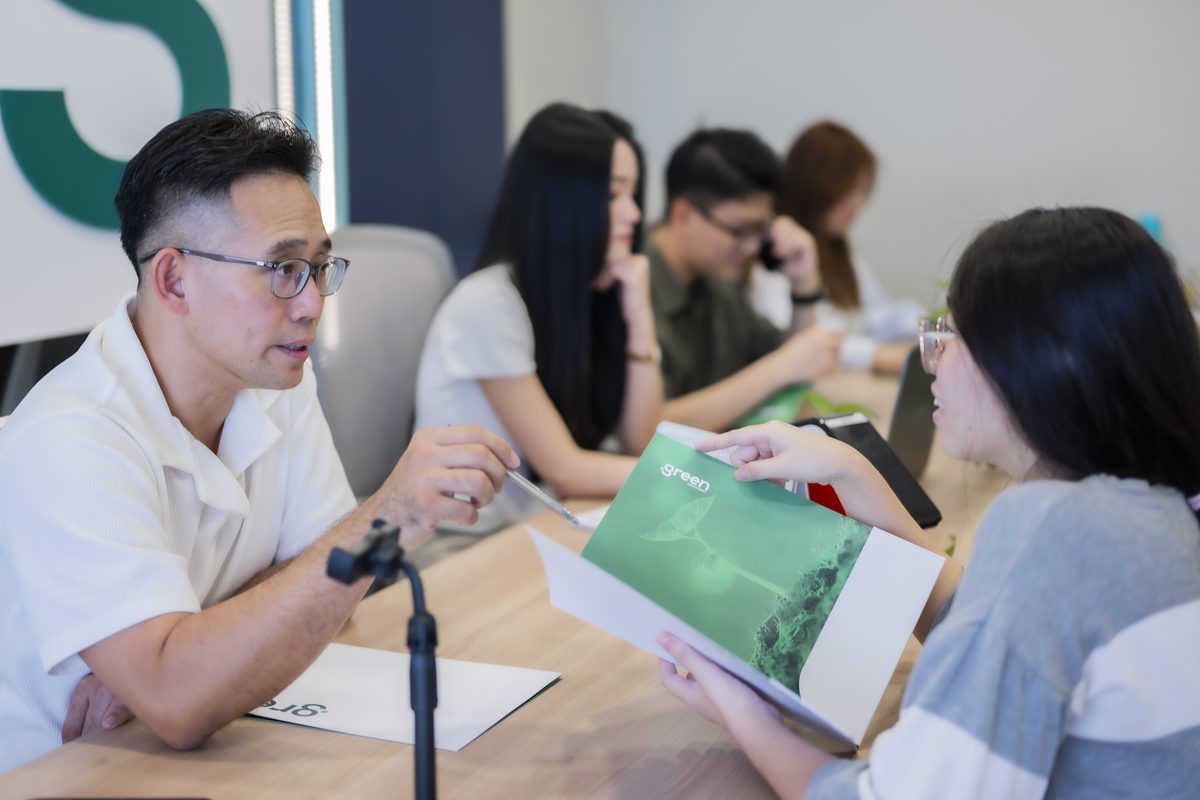 The Green Employment team with a family during a consultation