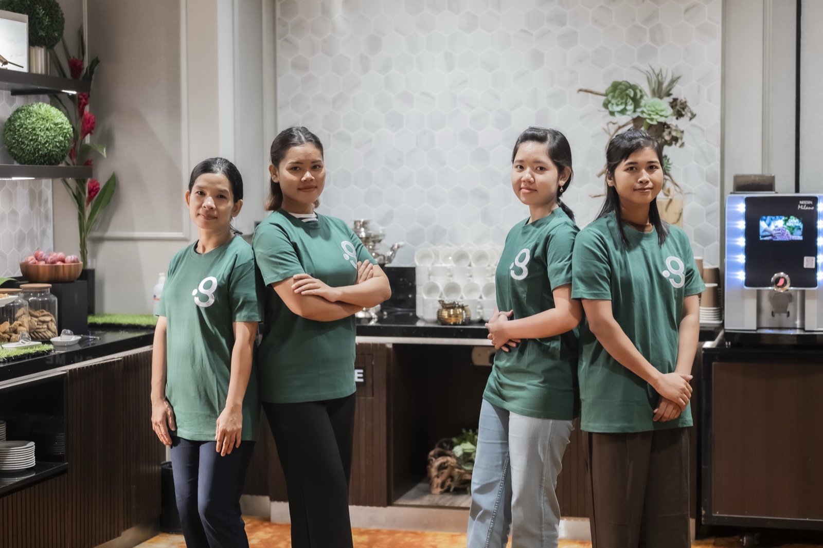 Domestic helpers placed through Green Employment, as a team in the green uniform